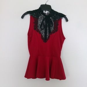 Red peplum sleeveless top. Black lace. Tie back